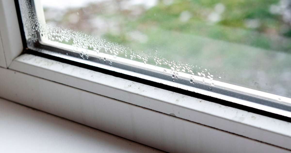 Window condensation running down the glass on a winter morning